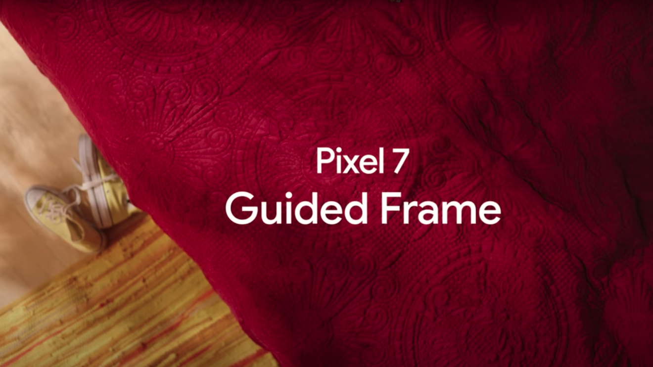 Pixel 7 Guided frame text against the backdrop of a red bedspread and yellow sneakers on a wooden floor.